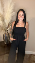 Load image into Gallery viewer, Black smocked wide leg jumpsuit with pockets
