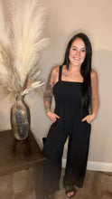 Load image into Gallery viewer, Black smocked wide leg jumpsuit with pockets
